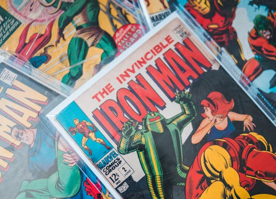 Close-up shot of vibrant vintage comic books featuring Iron Man and Thor.